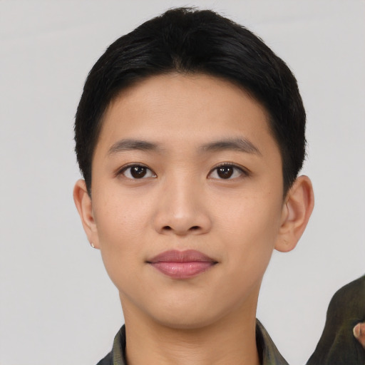 Joyful asian young-adult male with short  black hair and brown eyes