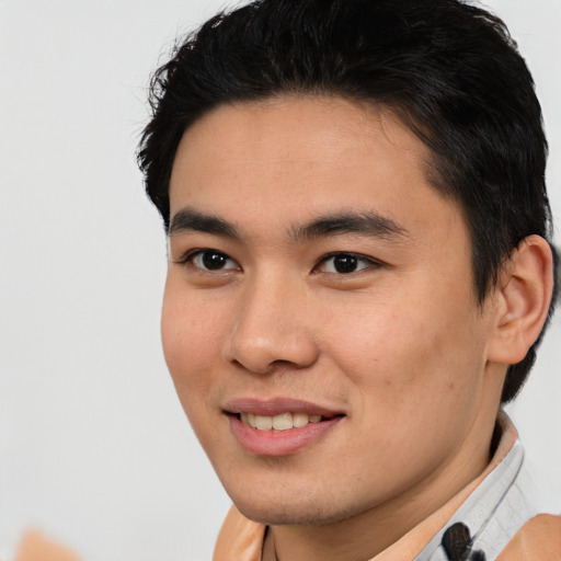 Joyful asian young-adult male with short  brown hair and brown eyes