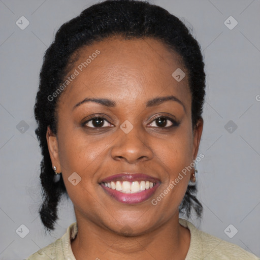 Joyful black adult female with medium  black hair and brown eyes