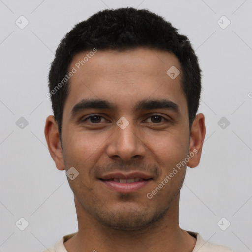 Joyful latino young-adult male with short  black hair and brown eyes