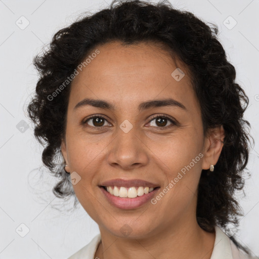 Joyful latino young-adult female with medium  brown hair and brown eyes