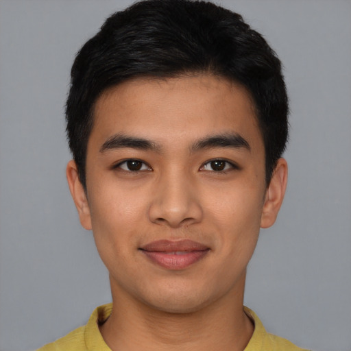 Joyful asian young-adult male with short  black hair and brown eyes