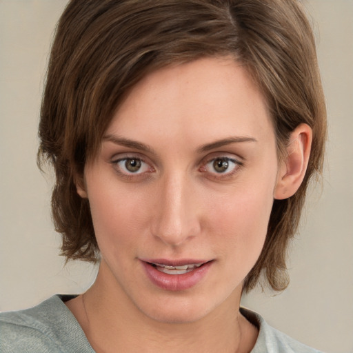 Joyful white young-adult female with medium  brown hair and green eyes