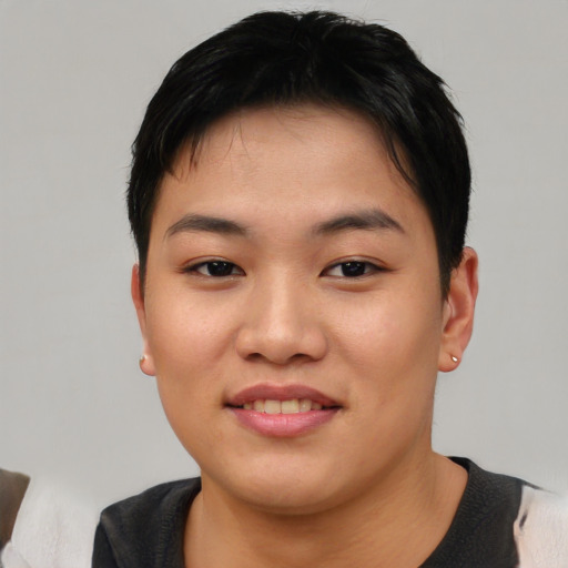 Joyful asian young-adult female with short  black hair and brown eyes