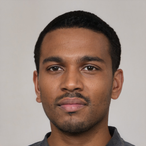 Neutral black young-adult male with short  black hair and brown eyes