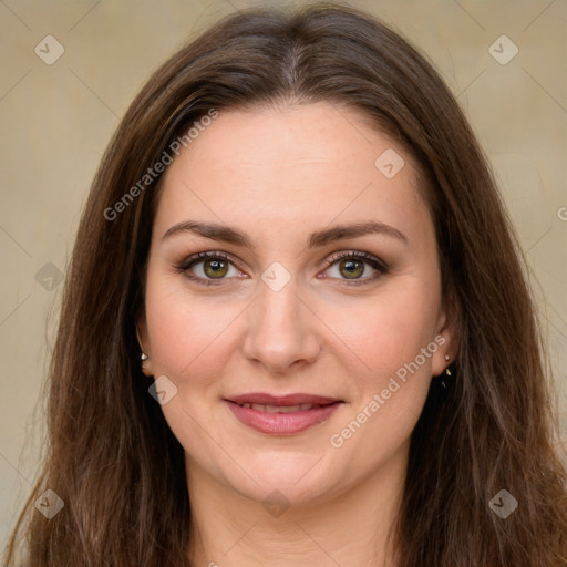 Joyful white young-adult female with long  brown hair and green eyes