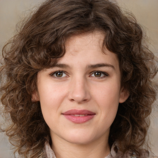 Joyful white young-adult female with medium  brown hair and green eyes