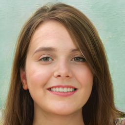 Joyful white young-adult female with long  brown hair and green eyes