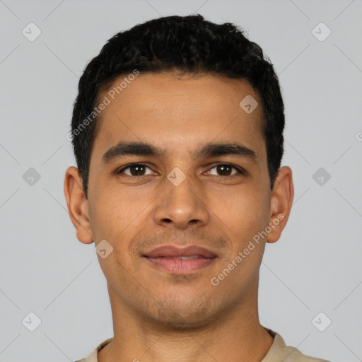 Joyful latino young-adult male with short  black hair and brown eyes