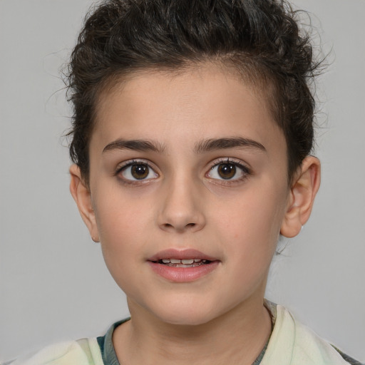 Joyful white child female with short  brown hair and brown eyes