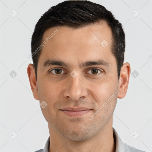 Joyful white young-adult male with short  black hair and brown eyes