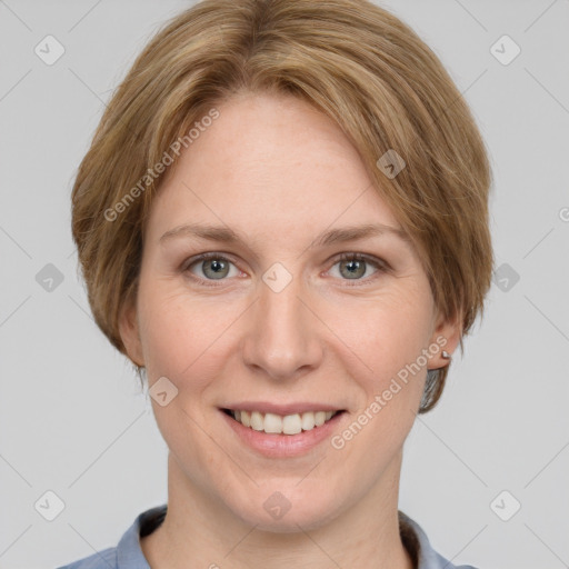 Joyful white adult female with short  brown hair and grey eyes