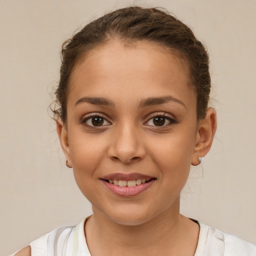 Joyful white child female with short  brown hair and brown eyes