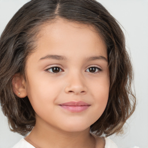 Joyful white child female with medium  brown hair and brown eyes