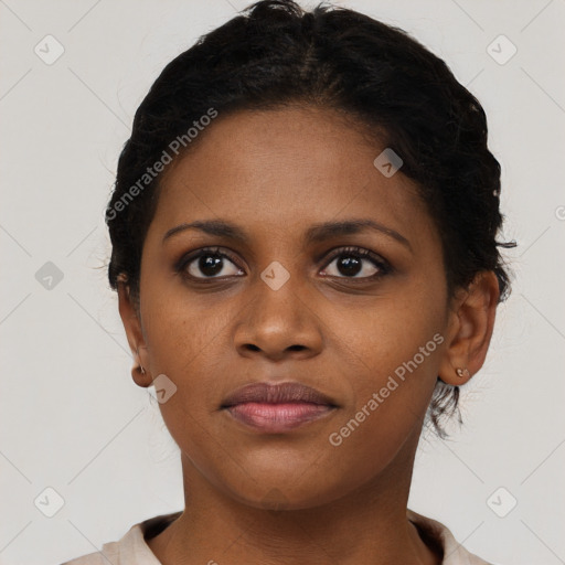 Joyful black young-adult female with short  brown hair and brown eyes