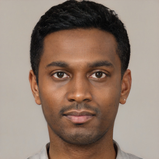 Neutral latino young-adult male with short  black hair and brown eyes