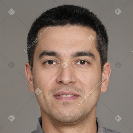 Joyful white young-adult male with short  black hair and brown eyes