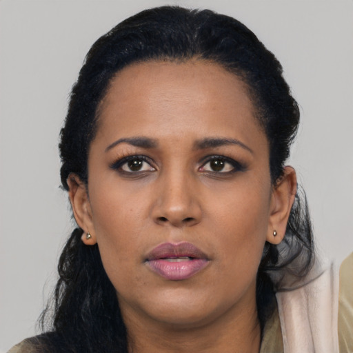 Neutral black young-adult female with long  black hair and brown eyes