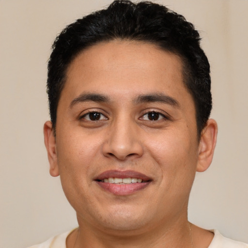 Joyful white young-adult male with short  brown hair and brown eyes