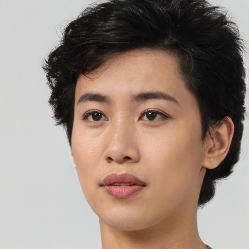 Joyful asian young-adult female with medium  black hair and brown eyes