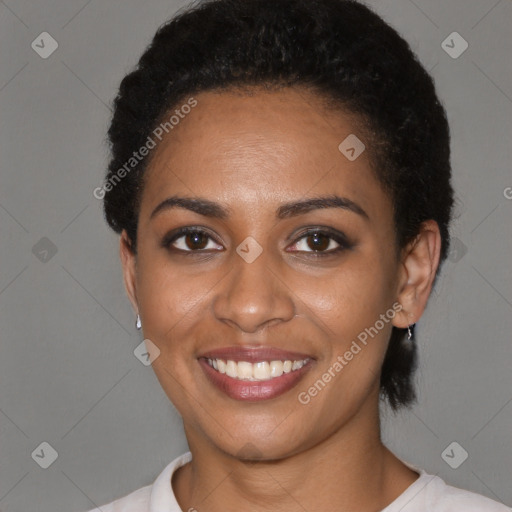 Joyful black young-adult female with short  black hair and brown eyes