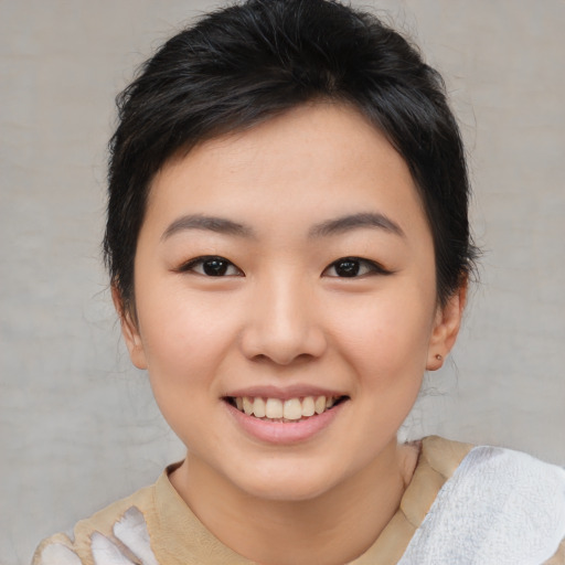 Joyful asian young-adult female with medium  brown hair and brown eyes