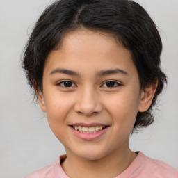 Joyful white child female with medium  brown hair and brown eyes