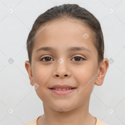 Joyful white child female with short  brown hair and brown eyes