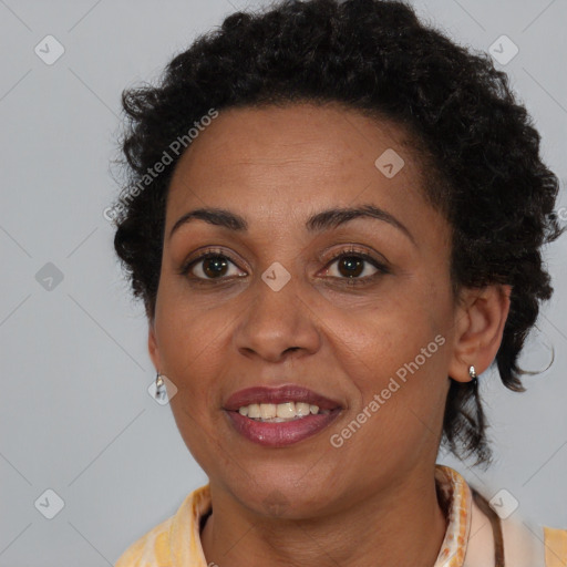 Joyful black adult female with short  brown hair and brown eyes