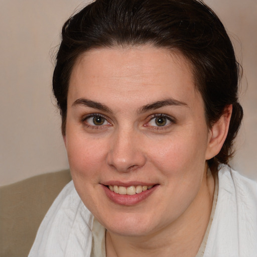 Joyful white young-adult female with medium  brown hair and brown eyes