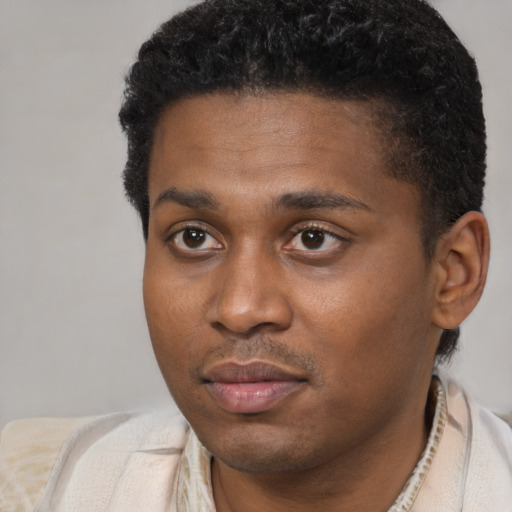 Neutral black young-adult male with short  brown hair and brown eyes