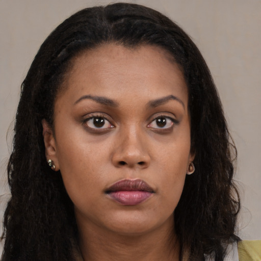 Neutral black young-adult female with long  brown hair and brown eyes