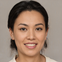 Joyful white young-adult female with medium  brown hair and brown eyes