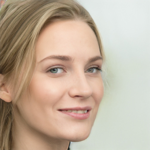 Joyful white young-adult female with long  brown hair and green eyes