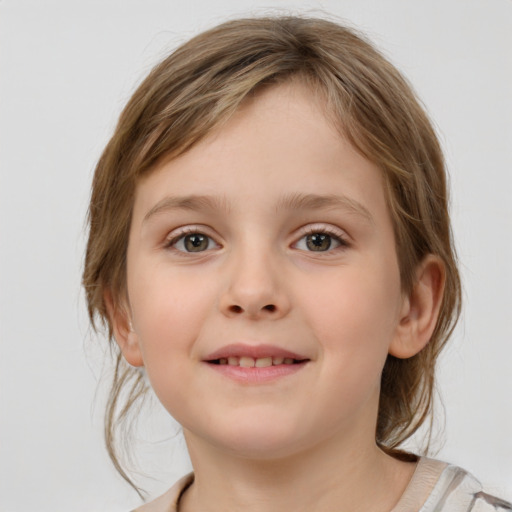 Joyful white child female with medium  brown hair and grey eyes