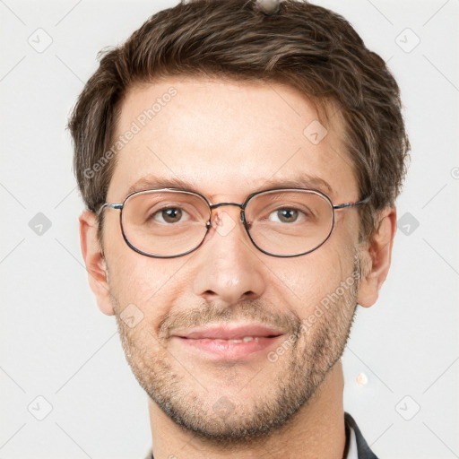 Joyful white adult male with short  brown hair and grey eyes