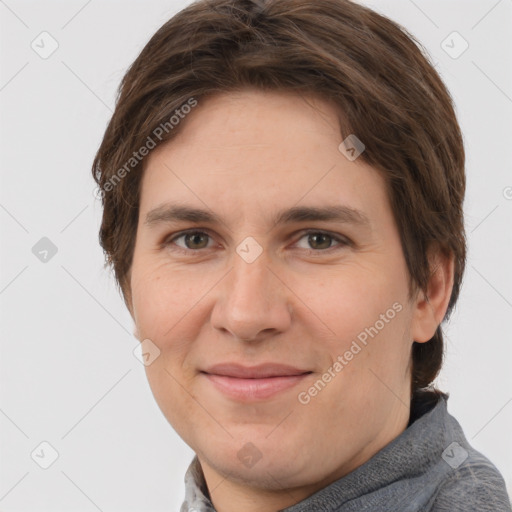 Joyful white young-adult female with short  brown hair and grey eyes