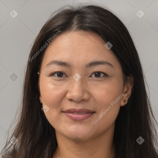 Joyful white adult female with long  brown hair and brown eyes