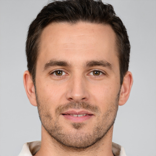 Joyful white young-adult male with short  brown hair and brown eyes