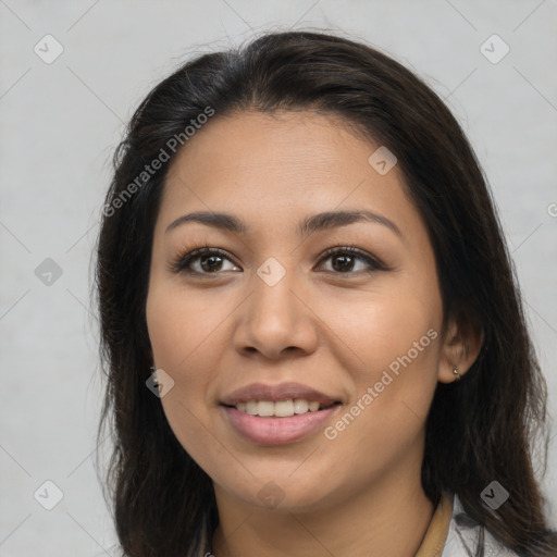 Joyful latino young-adult female with long  brown hair and brown eyes