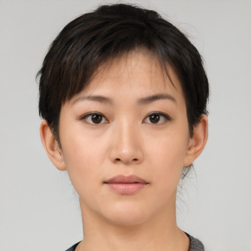 Neutral white young-adult female with short  black hair and brown eyes