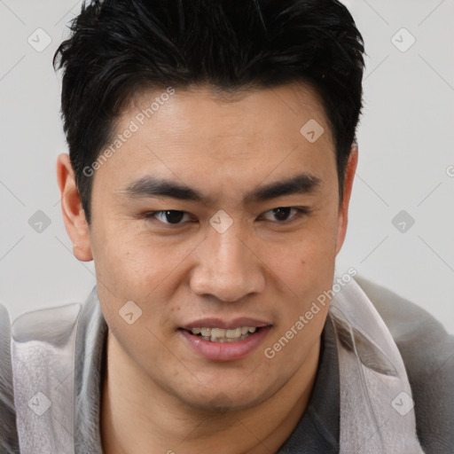 Joyful asian young-adult male with short  brown hair and brown eyes