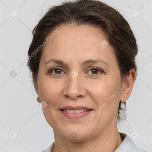 Joyful white adult female with short  brown hair and brown eyes