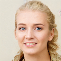 Joyful white young-adult female with long  brown hair and blue eyes