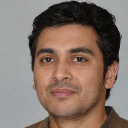 Neutral white young-adult male with short  black hair and brown eyes