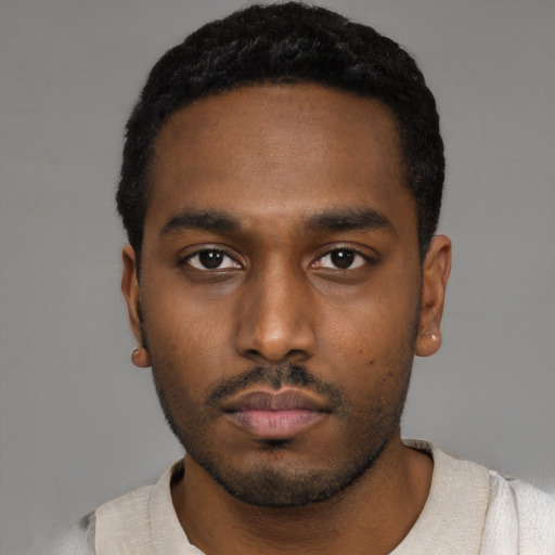 Neutral black young-adult male with short  black hair and brown eyes