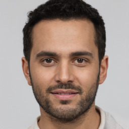 Neutral white young-adult male with short  black hair and brown eyes