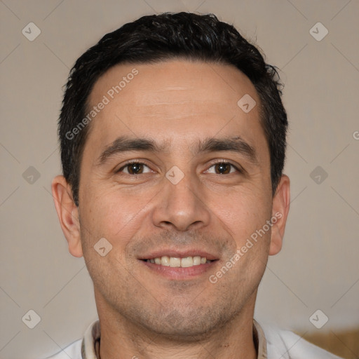 Joyful white adult male with short  brown hair and brown eyes