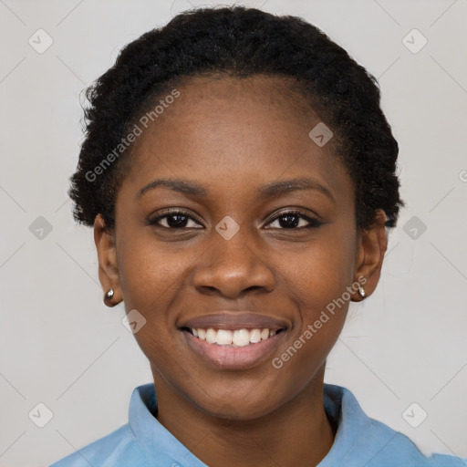 Joyful black young-adult female with short  black hair and brown eyes