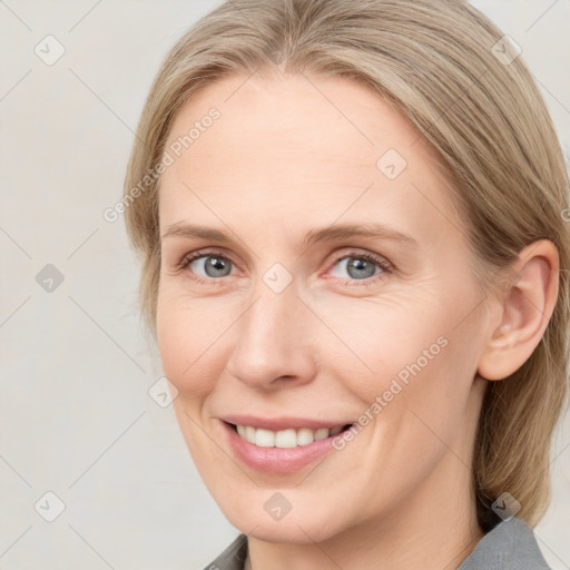 Joyful white young-adult female with medium  brown hair and blue eyes